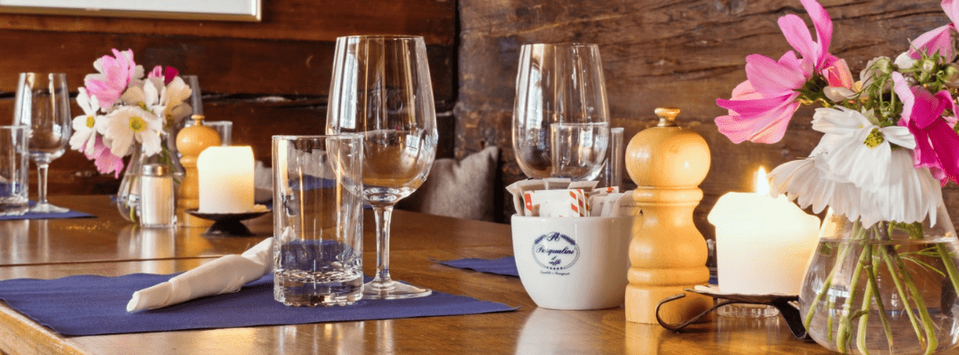 Testimonials Wine Glass on table